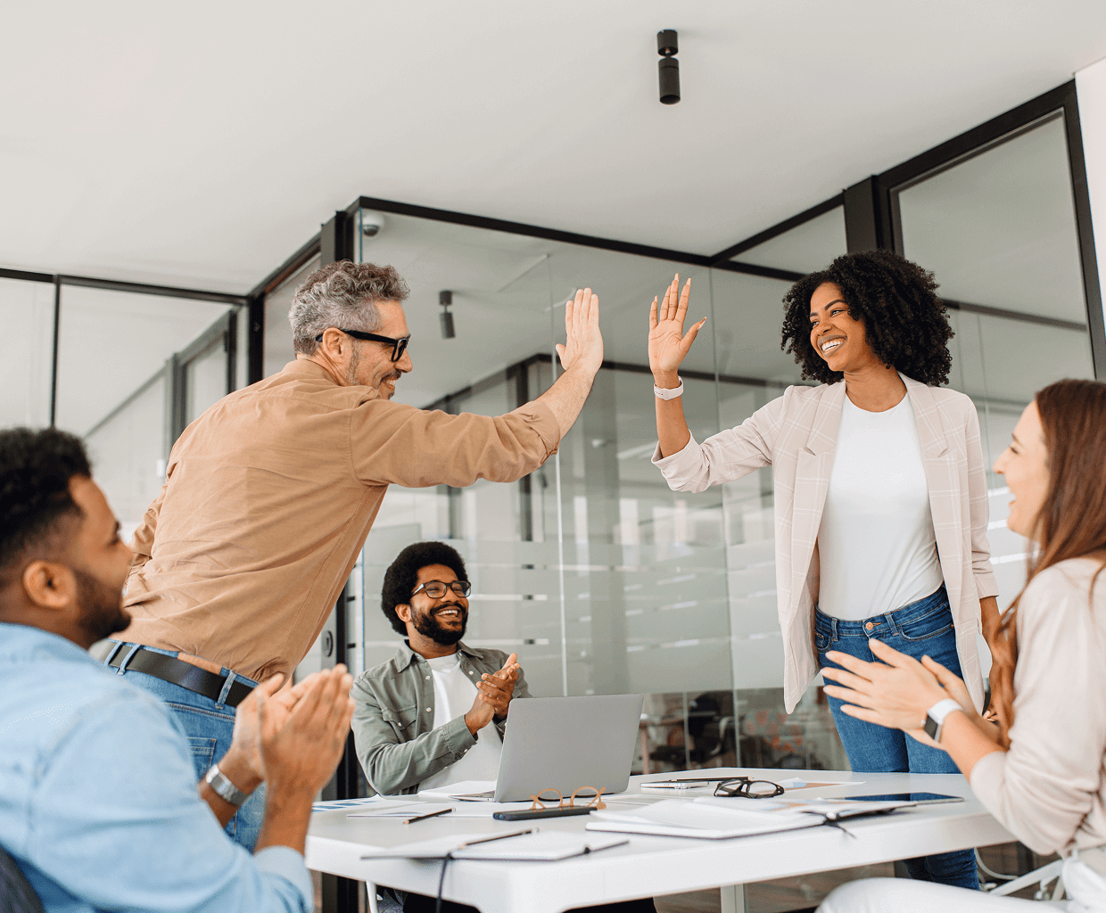 Colleagues celebrating with a high-five