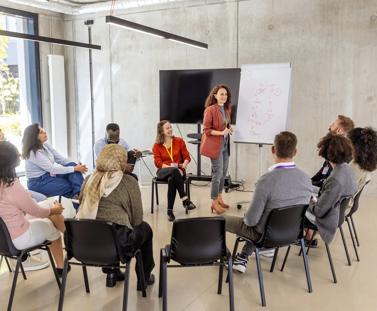 Woman leading diverse group discussion