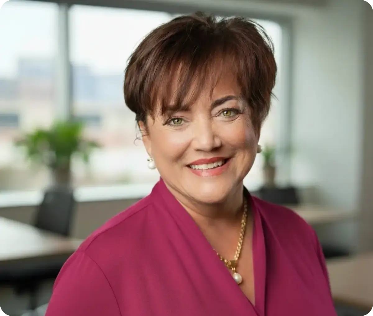 Smiling professional woman in magenta blazer